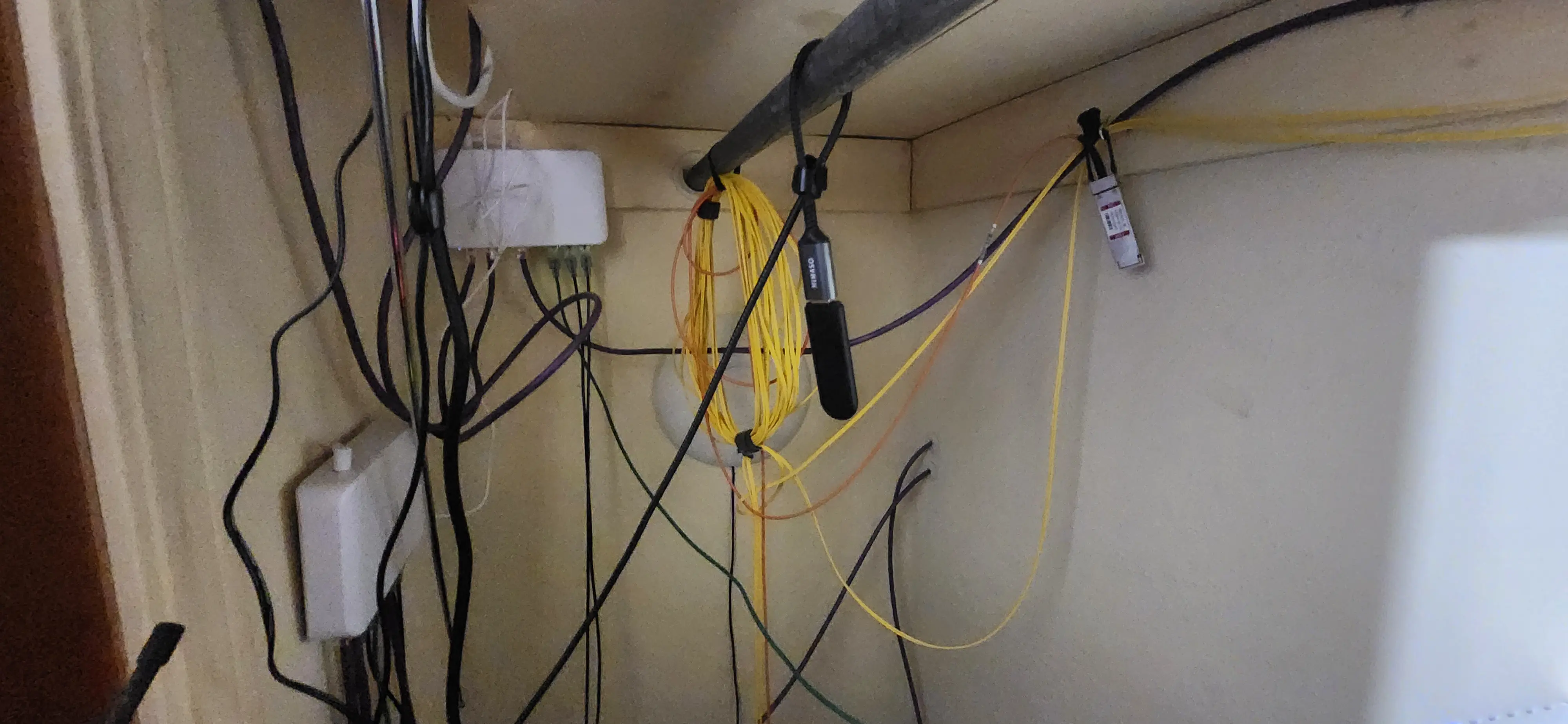 Picture of cables hanging everywhere before