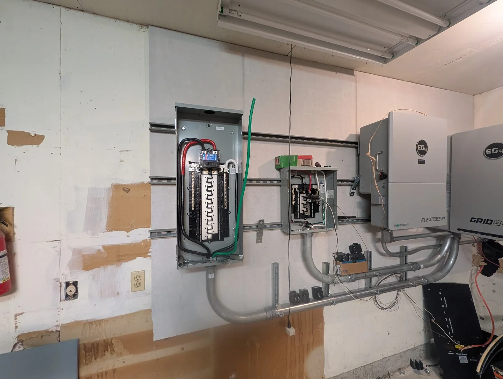 Main panel and subpanel both wired up, feeders dressed and landed on the buses