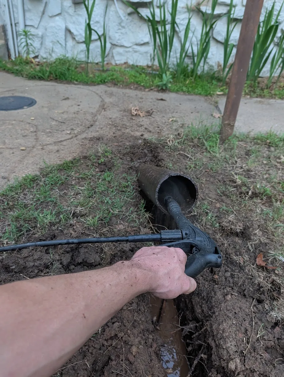 Using a pressure washer to bore under the sidewalk