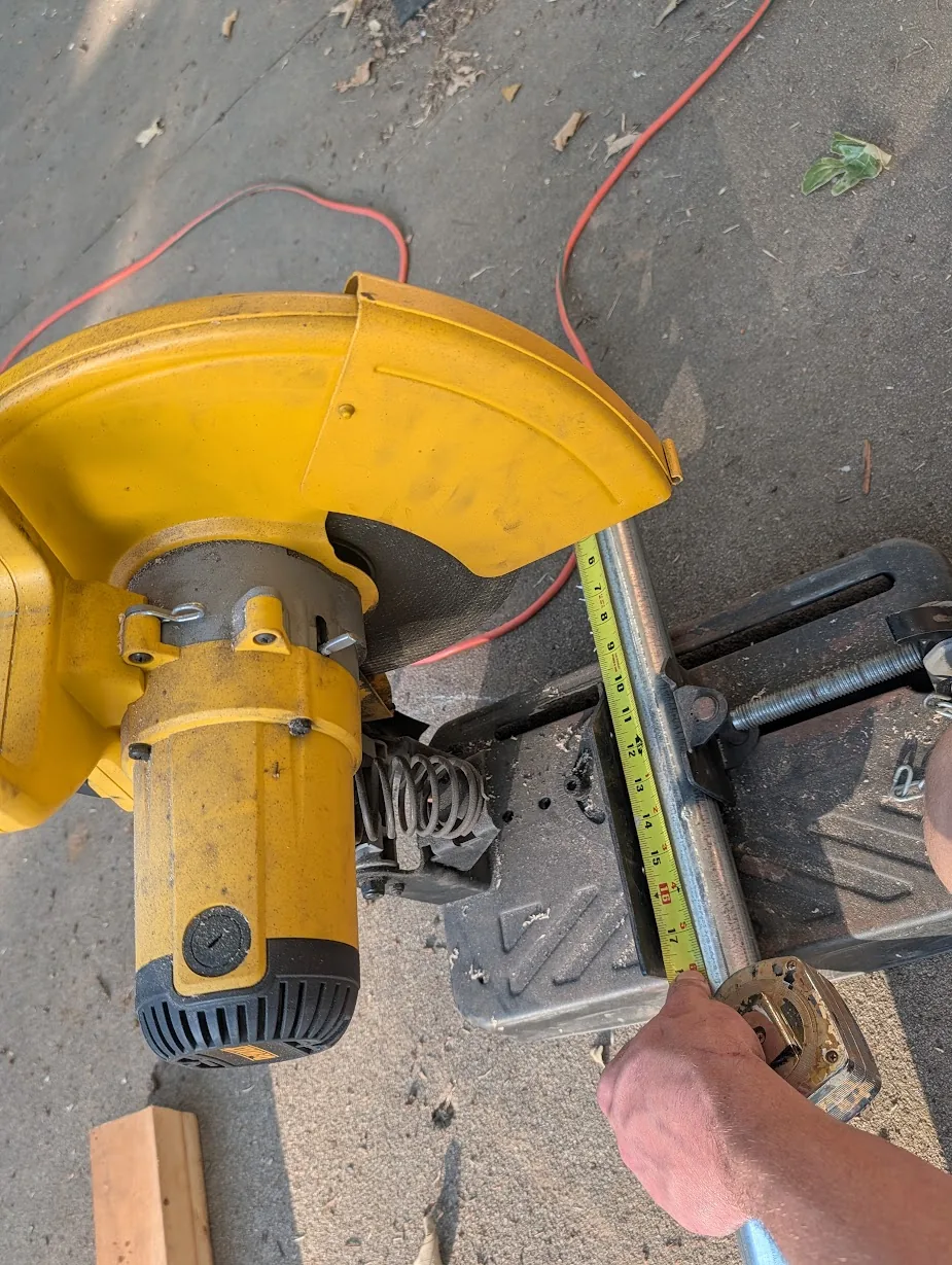 Dewalt D28710 14" abrasive chop saw cutting a section of 2" EMT