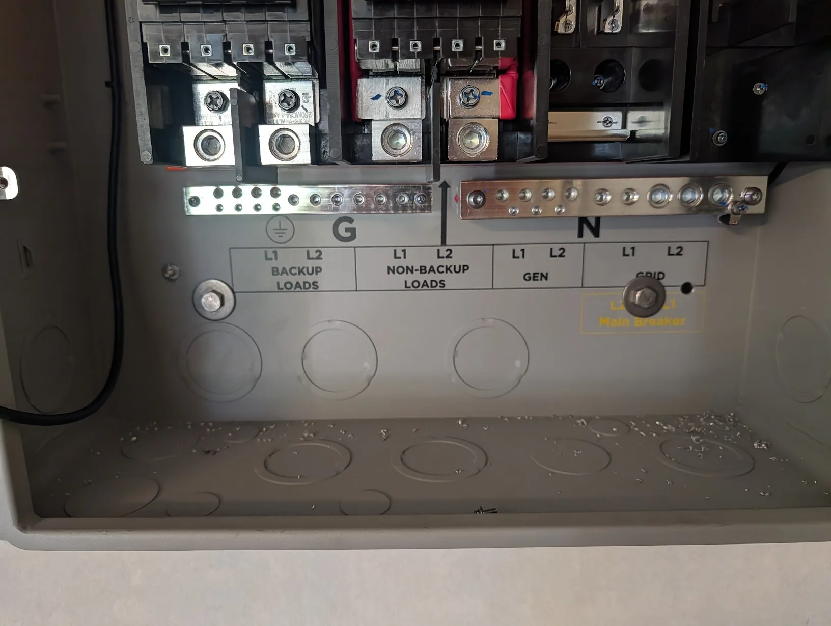 Inside the GridBoss cabinet showing the extra fasteners drilled through the case into the strut