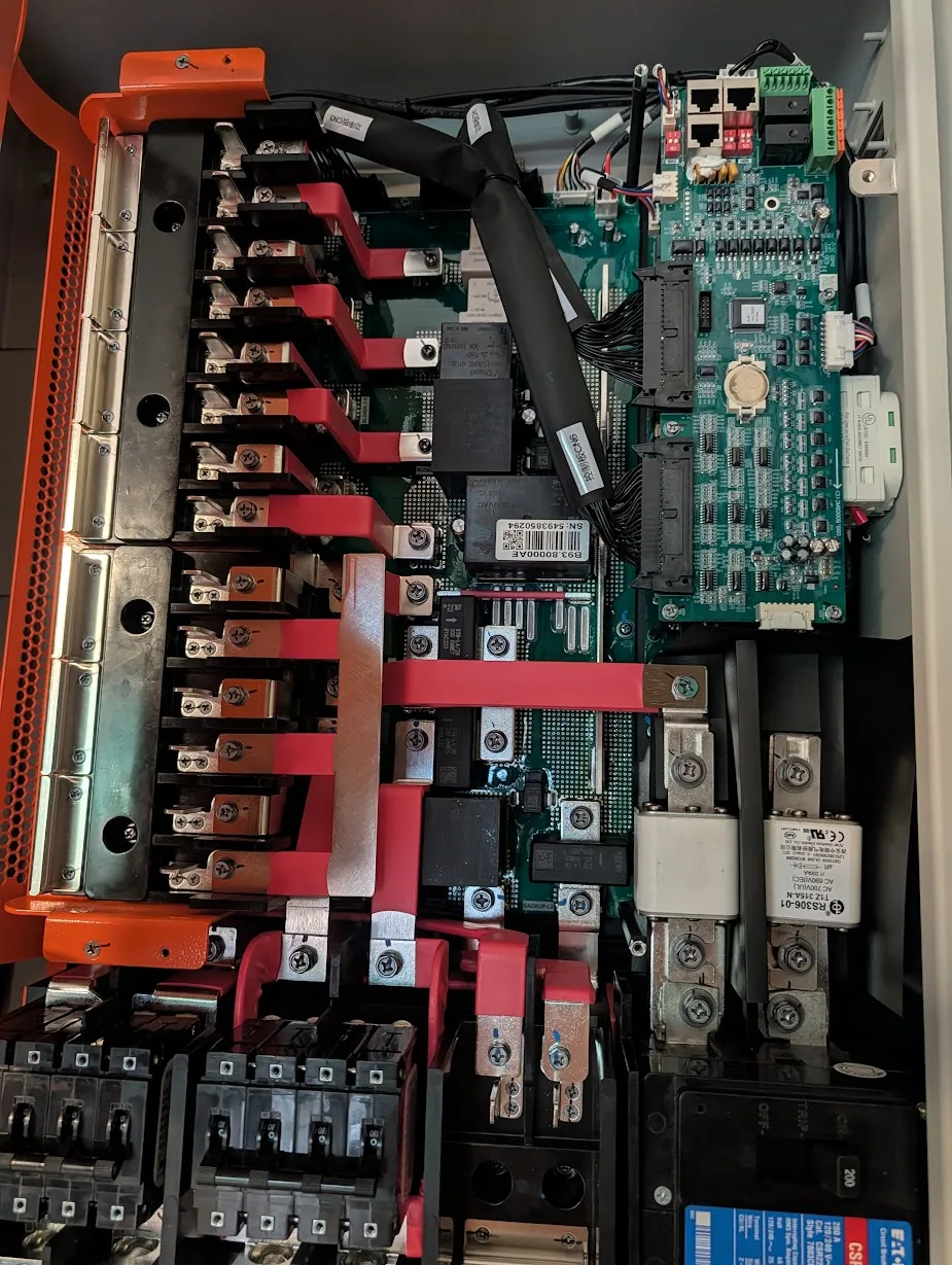 GridBoss internals showing copper bus bars and the control PCB