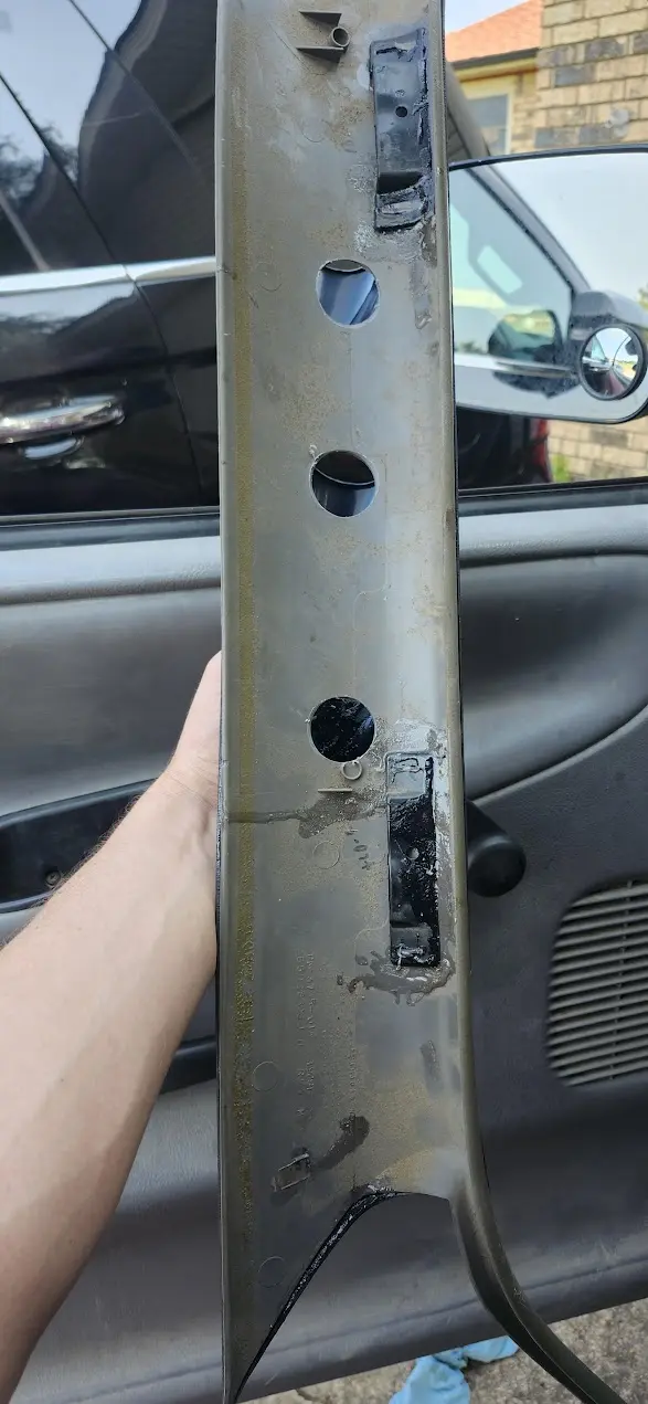 Image showing the rear of my factory trim, with lots of two-part epoxy holding it together.