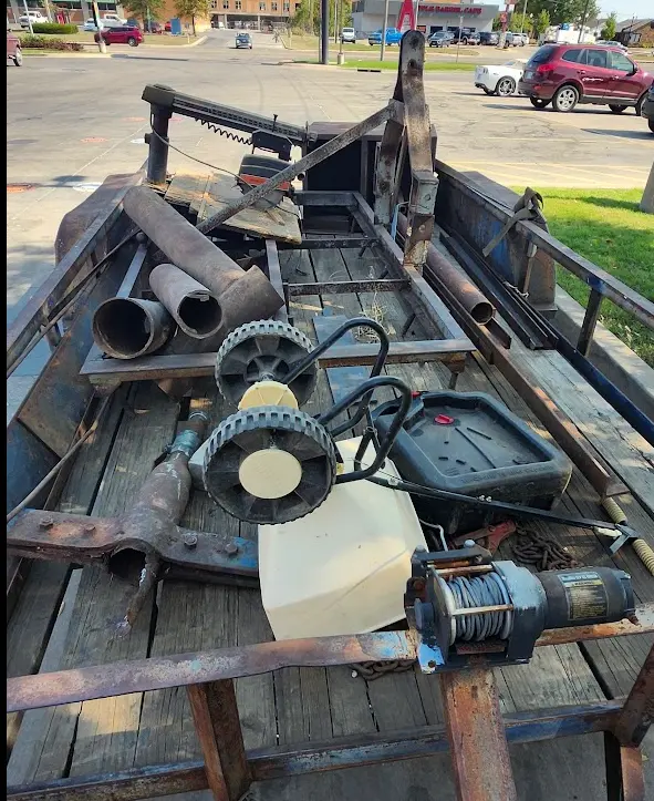 Photo showing the trailer leaving the auction full of scrap metal.