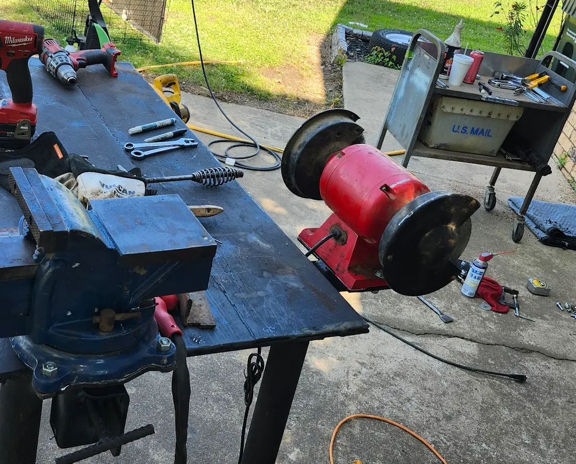 Photo showing the rear of the bench grinder mounted